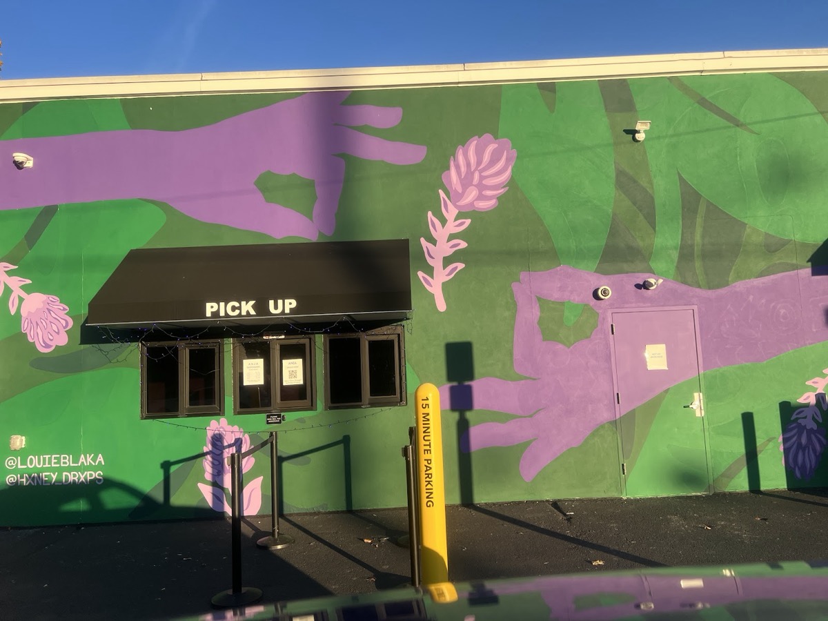 ANJA drive-up pickup window and purple-and-green mural on the Woodbridge Avenue building